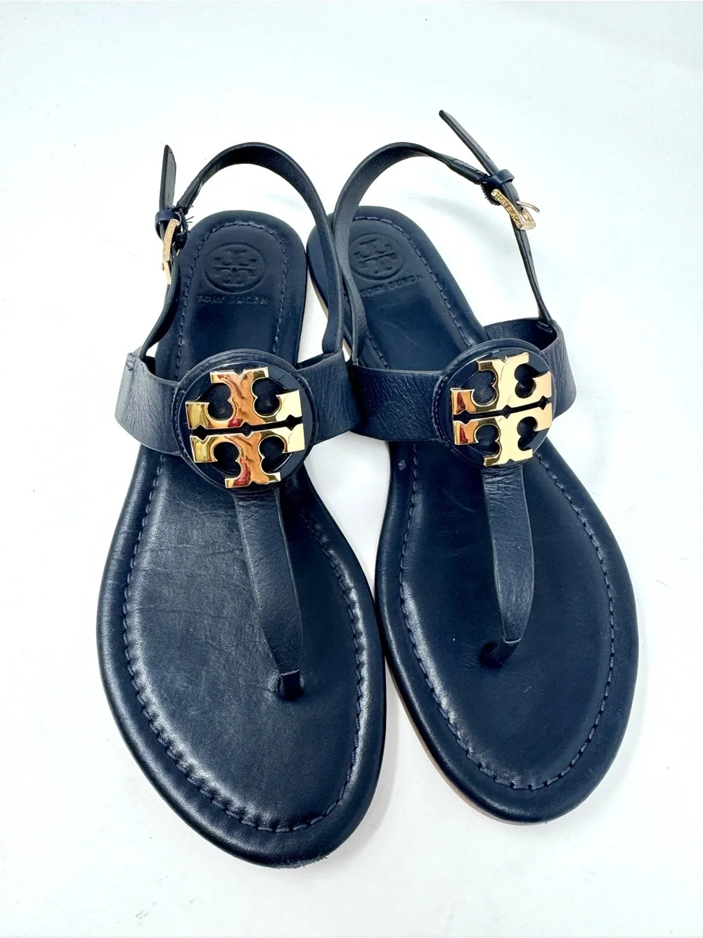 Tory Burch Bryce Navy Leather Logo Thong Sandals with Gold Logo Medallions